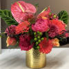 A raucous blend of Coral-Pink Anthurium, lush Fuchsia Peonies, Dahlias, and cheerful