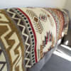 Patterned upholstered bench or sofa with geometric textile