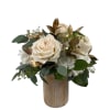 Cream roses in a wooden vase with green foliage