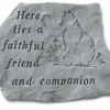 Engraved stone plaque with a cat and the words 'Here lies a faithful friend and companion'