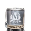 A black tin candle labeled "Perfect Gentleman" with a hanging tag