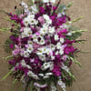 Large standing floral spray with white daisies and magenta blooms