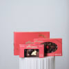 Three boxes of assorted chocolates tied with gold ribbon