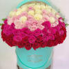 Heart-shaped box filled with pink, white, and red roses