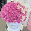 A lush dome of bright pink roses creates an opulent, romantic statement