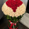 Large bouquet of red and cream roses in a round arrangement