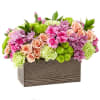 Mixed pink, peach, and green flowers in a rectangular wooden box