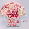 Pink and cream roses in a white box with a heart message