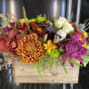 Long lasting florals in fall colors in a 8 inch box.
