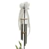 White ribbon-tied wind chime hanging on a black stand
