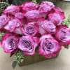 Bouquet of pink and lavender roses with succulent accents