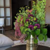 Deep burgandy flowers zing with the lime green accents in this stunning