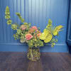 Electric arrangement of Lime green and peach with a mix of traditional