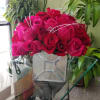 MIXTURE OF RED &amp; HOT PINK ROSES IN A MIRROR GLASS CUBE.