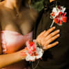 White and bright pink orchids take center stage in this prom flower