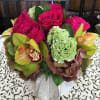 pink garden roses, green orchids, coxcomb, with hydrangea accents in modern vase.
