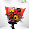 Bouquet of red and yellow flowers wrapped in orange paper