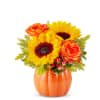 Sunflower and orange rose arrangement in an orange pumpkin vase