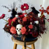Make a bold statement this Halloween with our Dark Enchantment floral arrangement