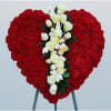 Heart-shaped red floral spray with white roses and calla lilies