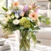 Mixed pastel bouquet in a clear glass vase