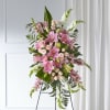 Tall standing floral spray with pink lilies, roses, and white snapdragons