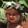Child wearing a flower crown outdoors