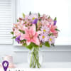Pink and lavender mixed bouquet in a clear glass vase