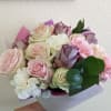 Bouquet of pink, white, and lavender roses with carnations