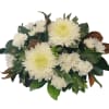 White chrysanthemum bouquet with glossy green leaves