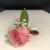 A pink rose with baby breath. The perfect rose to fit on