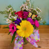 A single sun-bright yellow or any color daisy greets the eye in