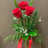 3 roses in a vase in a wide variety of colors and