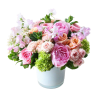 Pink and peach flower arrangement in a white vase