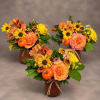 Three autumn floral arrangements with orange roses and yellow daisies in brown vases