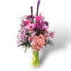 Pink and purple mixed bouquet in a clear glass vase