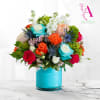 A burst of vivid color-bright turquoise roses paired with orange, pink, peach