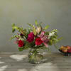White snapdragons and surprising pink hybrid lilies offer a subtle twist to