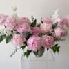 An abundance of beautiful pink peonies and fragrant sweet peas. 