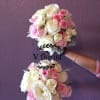 With its rich shades of pink and accents of white and green