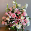 Pink and white mixed bouquet with roses, lilies, and daisies
