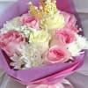 Pink and cream roses with white daisies and a gold crown topper