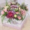 Mixed pink and lavender bouquet in a white gift box