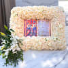 Cream rose floral frame with a central religious image and white lilies