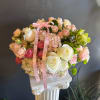 Pink and white rose bouquet with hydrangeas and a pink ribbon