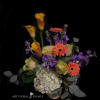 Bouquet with orange calla lilies, gerbera daisies, purple flowers, and white hydrangea