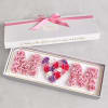 Gift box with pink roses arranged as MOM and a heart