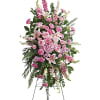 Tall pink floral standing spray on an easel