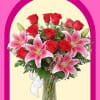 Bouquet of red roses and pink lilies in a glass vase
