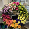 Large circular wreath of mixed flowers on a stand